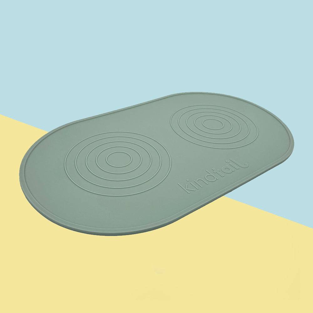KindTail silicone dog food mat with raised edges, non-slip surface, and colorful design for easy feeding and cleaning.