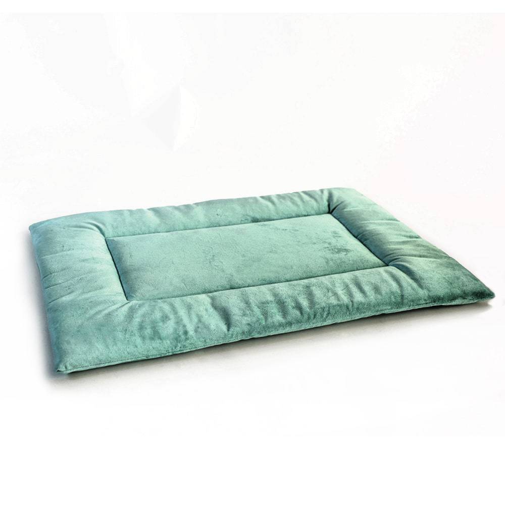 Green PAWD Crate Pad and dog bed by KindTail, plush and comfortable for small to medium dogs, ideal for crates and lounging.