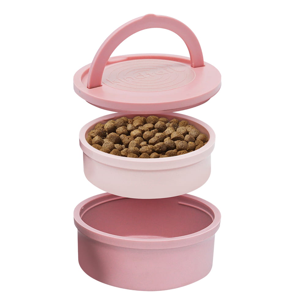Pink portable travel dog bowl by KindTail, collapsible pet feeder and waterer for convenient on-the-go pet care.
