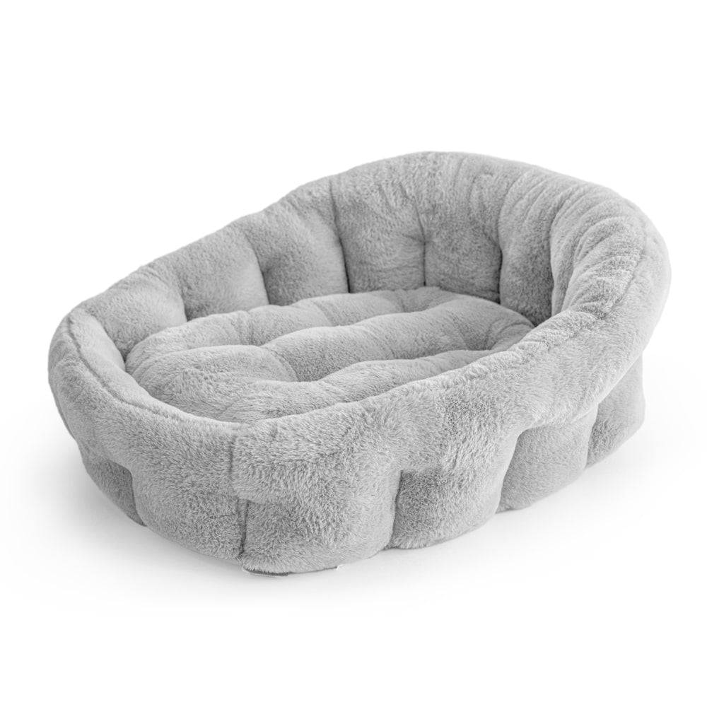 Light grey Calming Lounger dog bed by KindTail with plush, cushioned surface perfect for small and medium dogs.