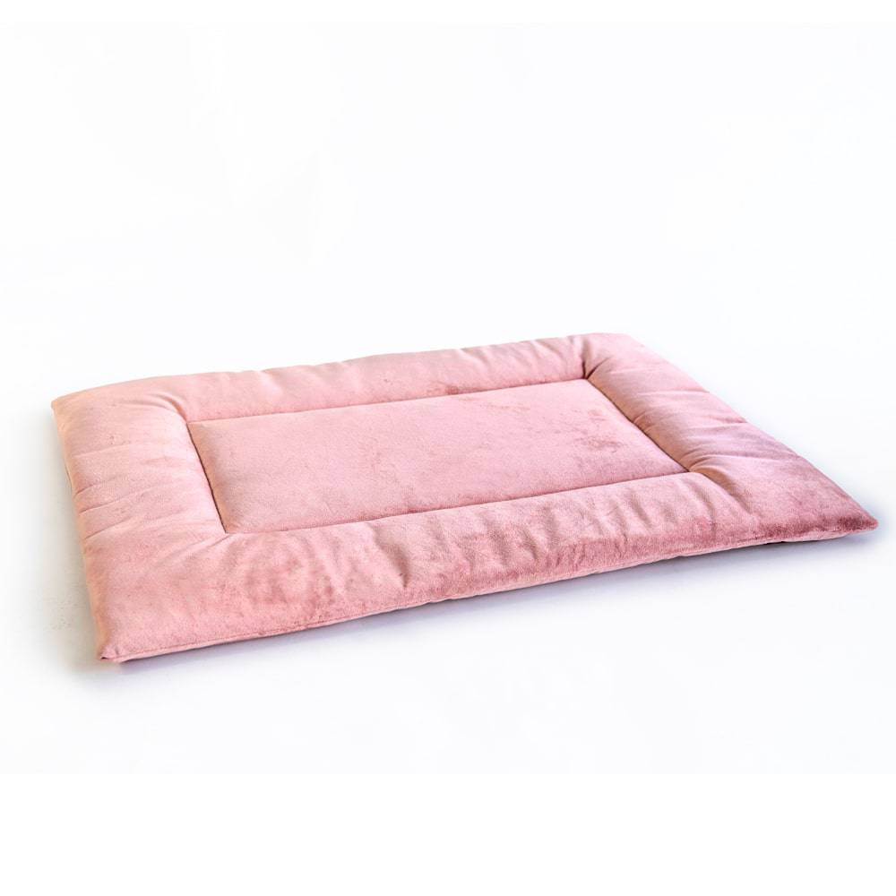 Pink PAWD Crate Pad and dog bed by KindTail featuring soft, cozy cushioning for comfortable pet rest.