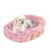 KindTail Lounger Pink dog bed with white dog 