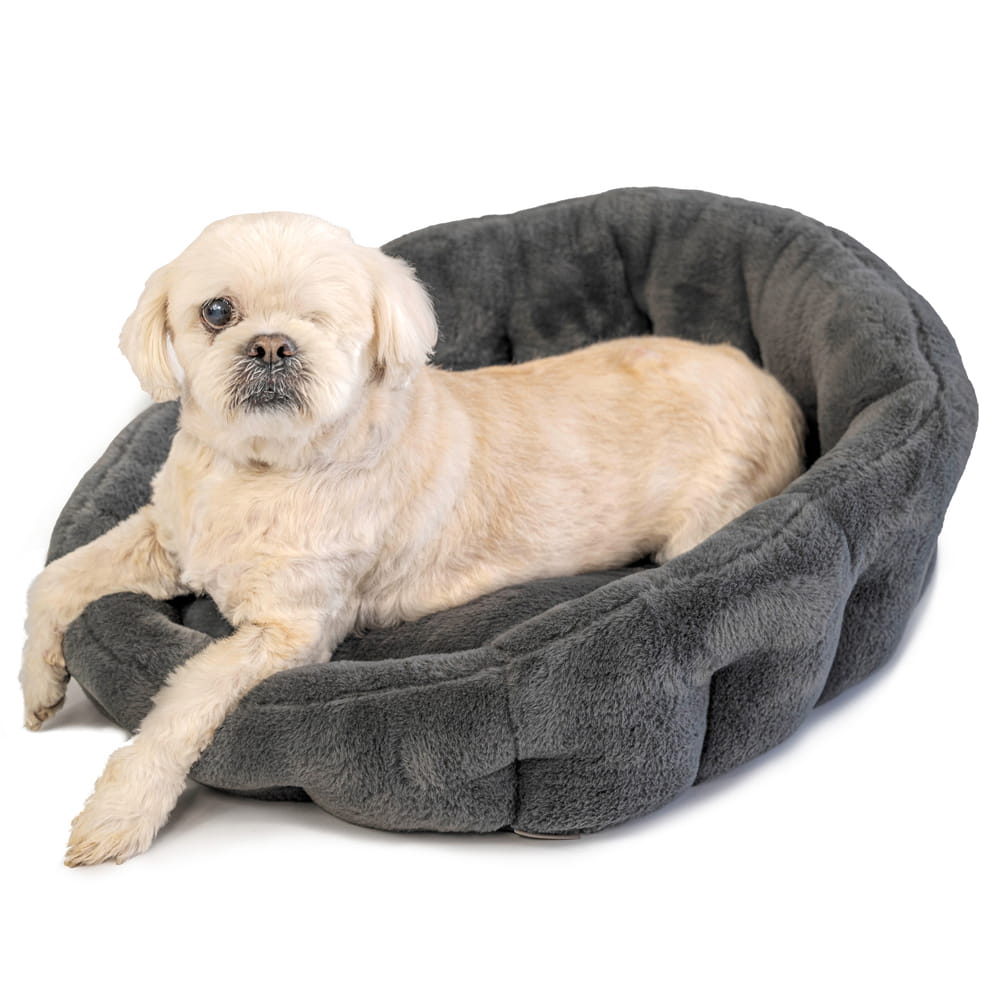 Dark grey Calming Lounger dog bed by KindTail with plush fabric and cushioned sides for comfort and relaxation.