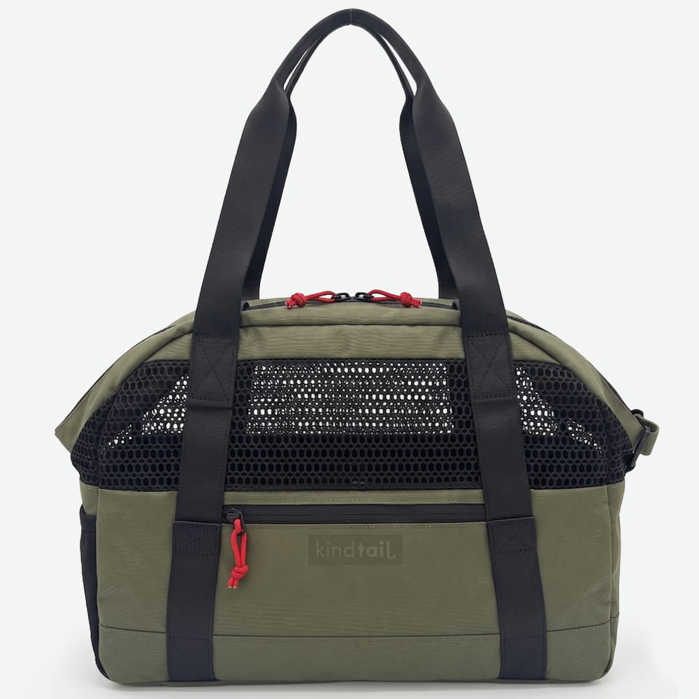 Green carrier bag by KindTail with sturdy handles, made from eco-friendly material, suitable for shopping or carrying essentials.