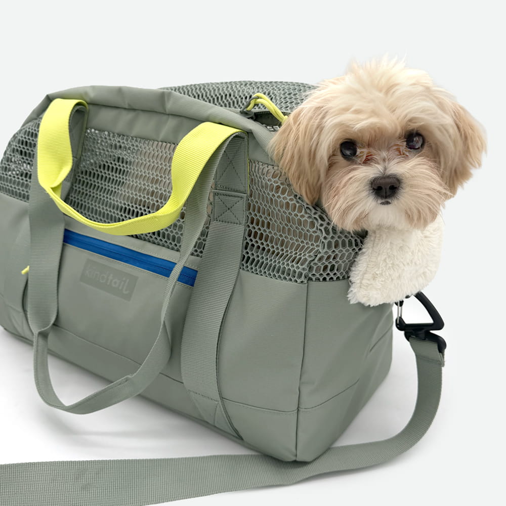 Grey KindTail carrier bag made of durable material, featuring a spacious design with sturdy handles for easy carrying.